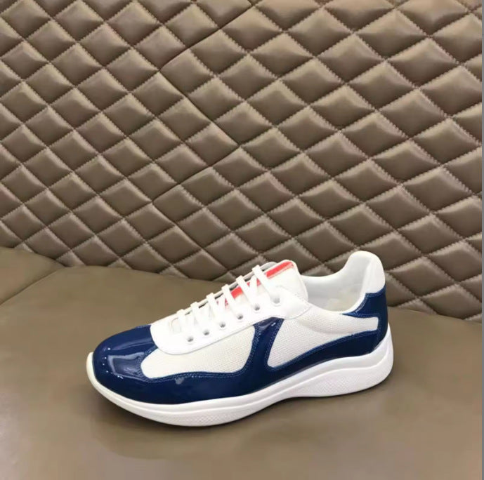 Blue and white sneaker on a textured brown surface