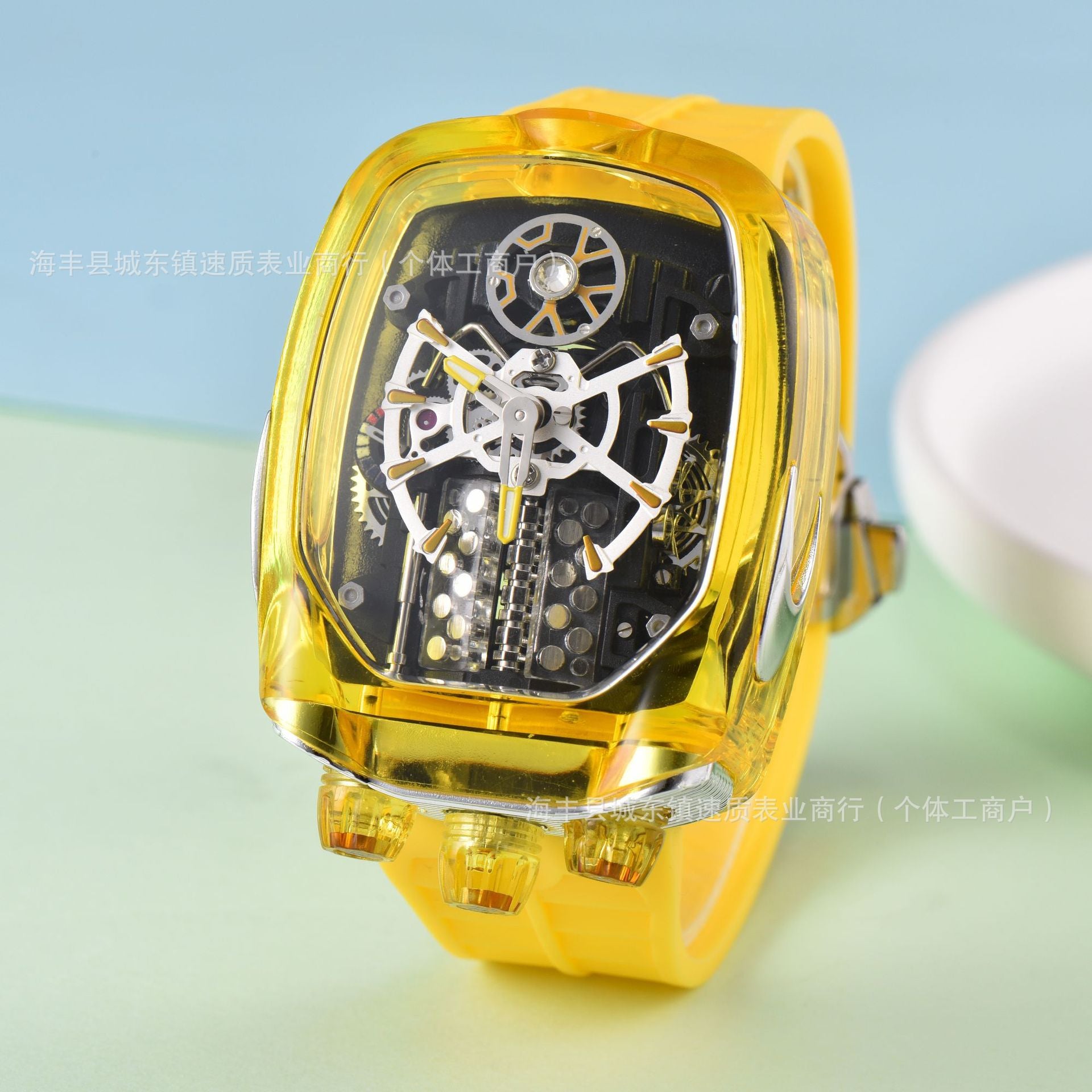 Yellow transparent watch with mechanical components on a light blue and green gradient background