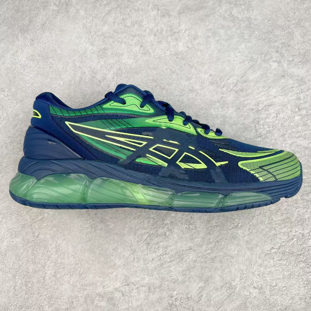Blue and green running shoe on a light gray background