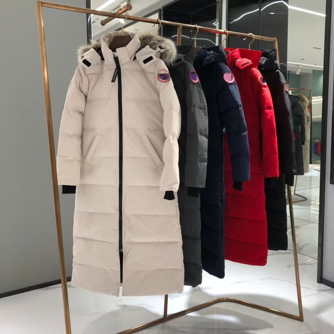 Row of winter coats on a rack in a store setting