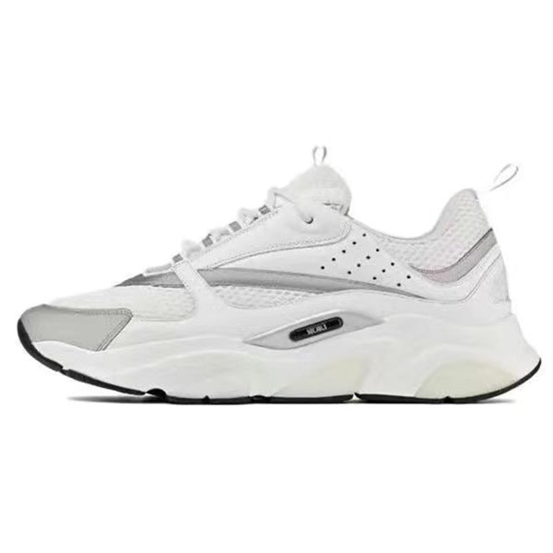 White athletic shoe with black sole on a white background
