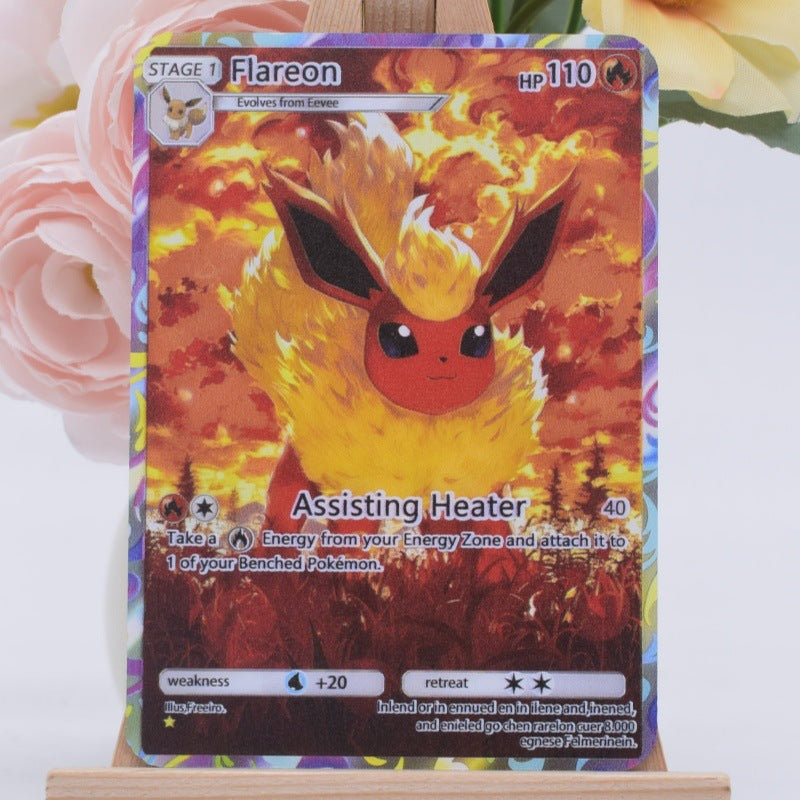 A holographic Pokémon trading card featuring Flareon, displayed on a small wooden stand with soft pink and yellow flowers in the background.