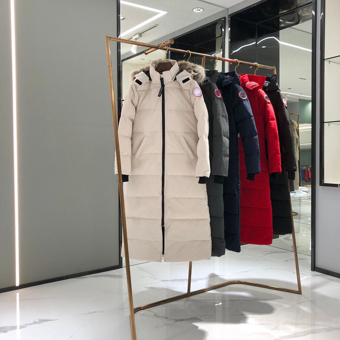 Row of winter coats on a rack in a store setting