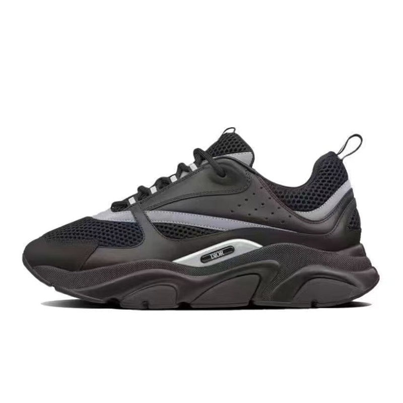 Black athletic shoe with a red label on a white background