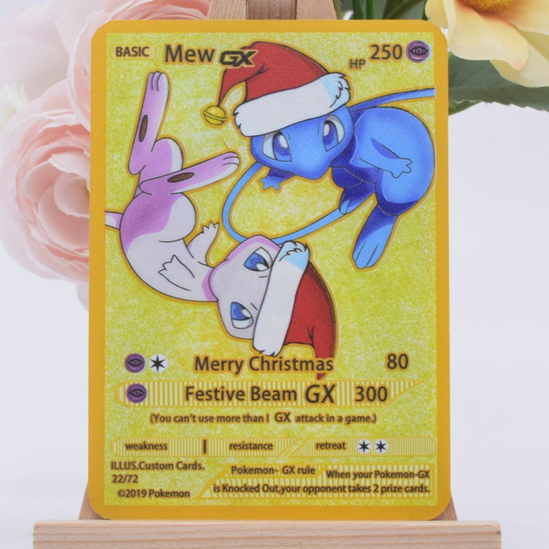 A custom Mew GX Christmas-themed Pokémon trading card displayed on a wooden stand with soft pink and yellow flowers in the background.
