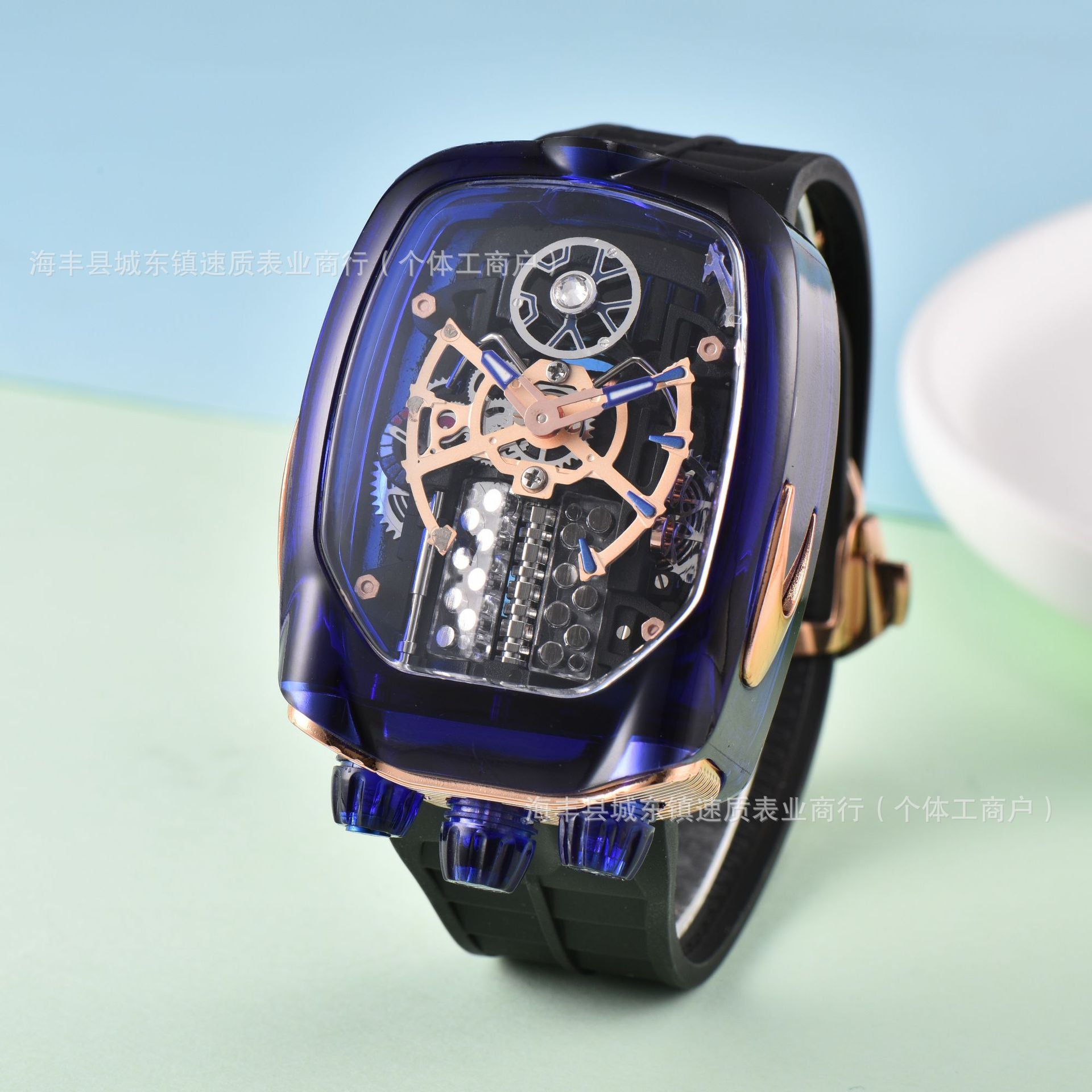 Luxury watch with intricate design on a light blue background