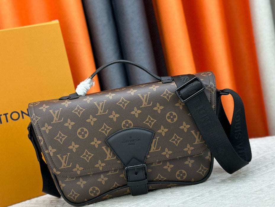 Louis Vuitton monogram bag with a strap on a textured surface with a branded box in the background.
