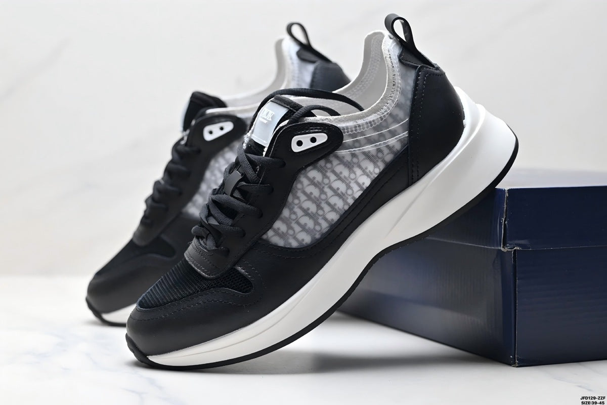 Black and white sneakers with a brand logo on a light gray background