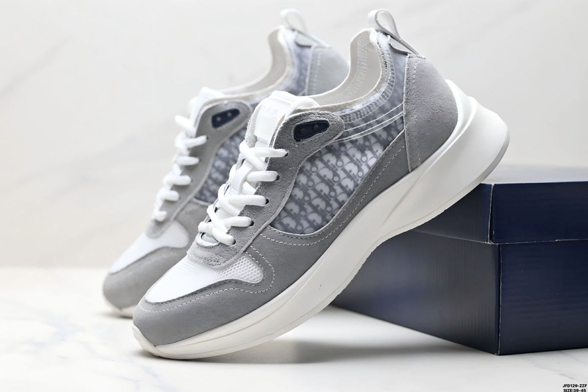 Gray sneakers with white soles on a light gray background
