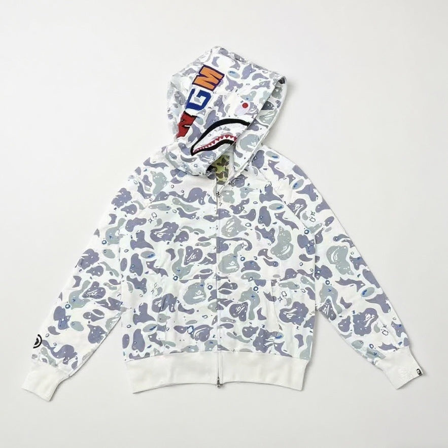 White hoodie with blue camouflage pattern on a light gray background
