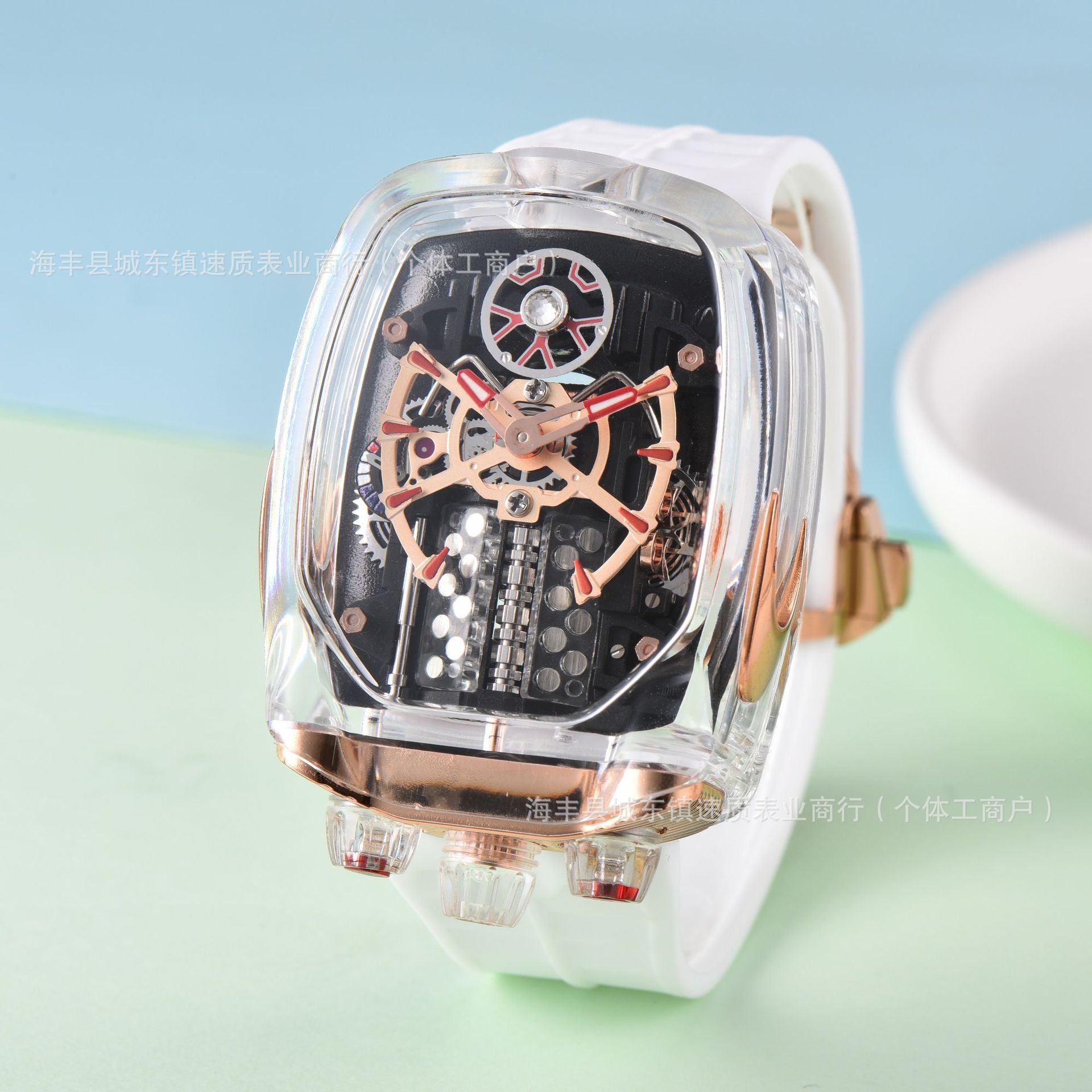 Luxury watch with transparent case and white strap on a light blue and green gradient background