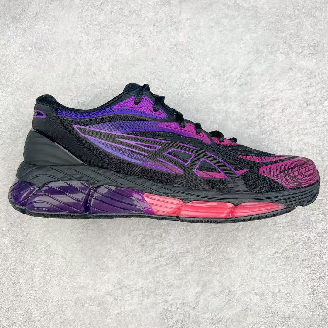 Black and purple running shoe on a textured gray background