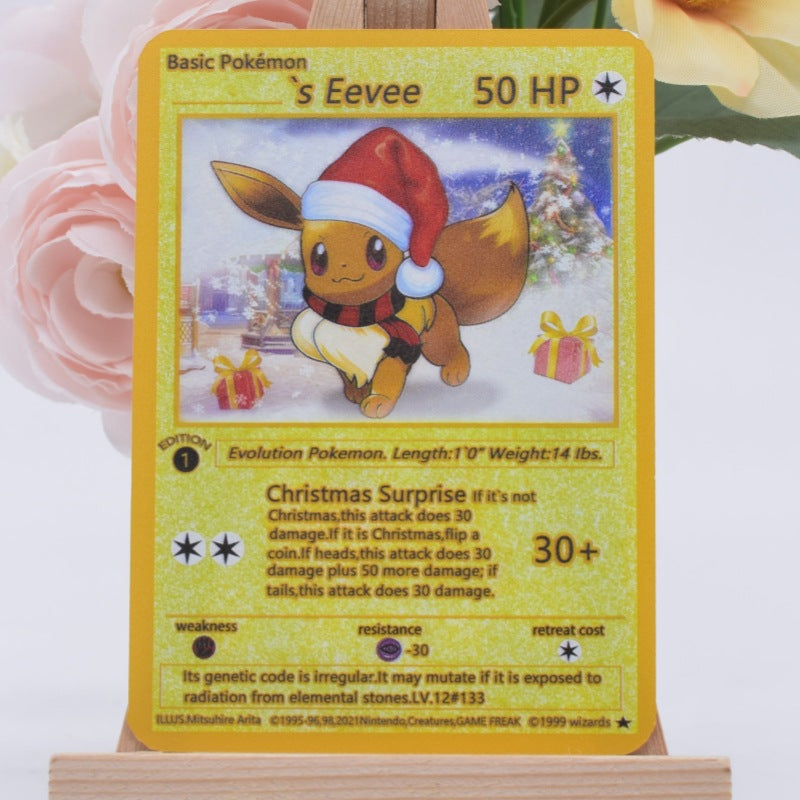 A holographic Pokémon 'Eevee' trading card with a Christmas theme, featuring Eevee wearing a red Santa hat and scarf. The card is displayed on a wooden stand with pink roses in the background.