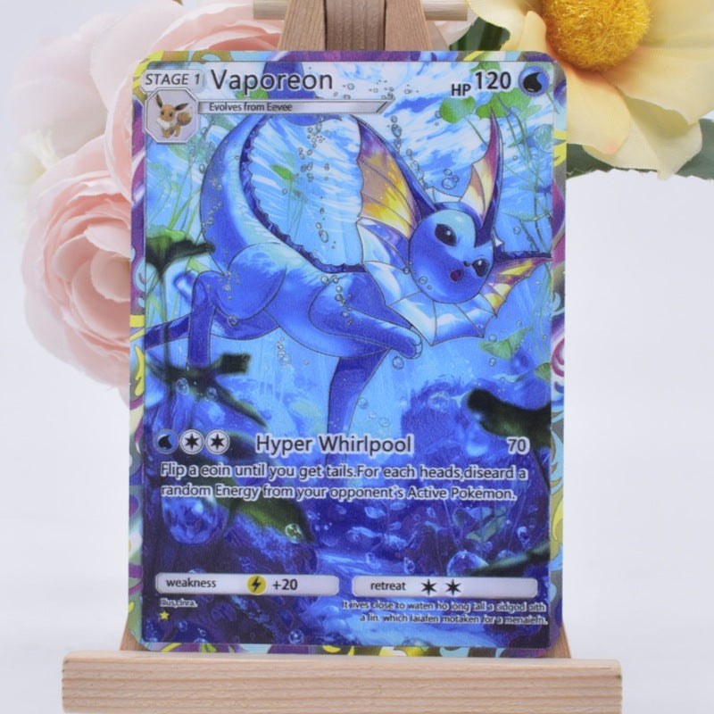 A holographic Pokémon trading card featuring Vaporeon, displayed on a small wooden easel with pink and yellow flowers in the background.