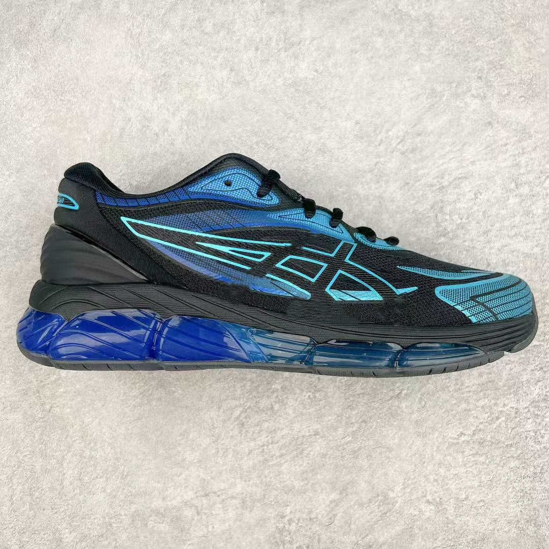 Black and blue running shoe on a light gray background