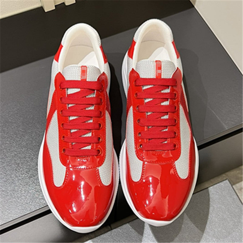 Red and white sneakers on a reflective surface