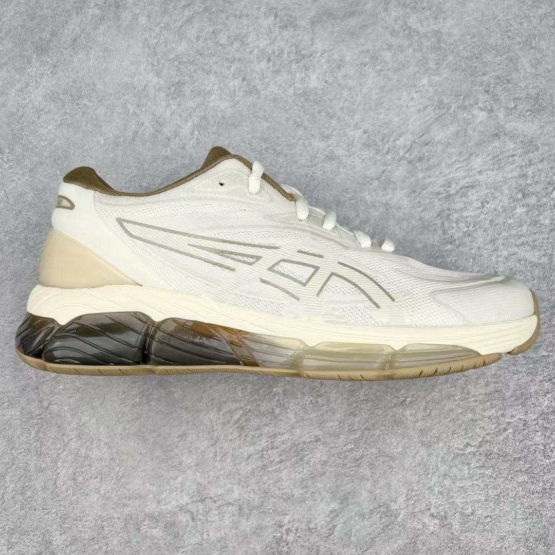 White athletic shoe with a visible sole on a gray background