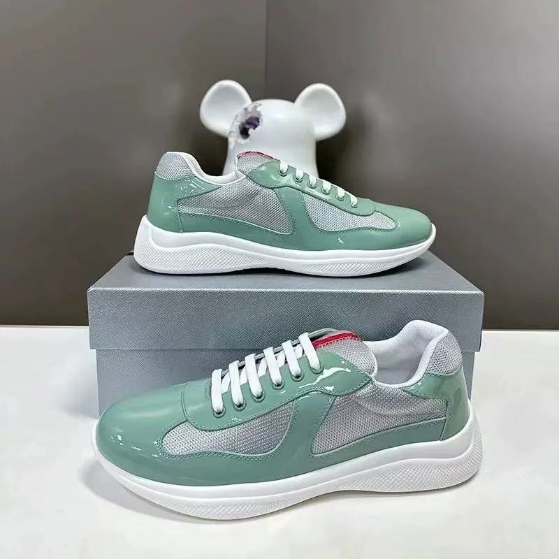 Green sneakers with white soles on a gray box, with a white mouse figure in the background.
