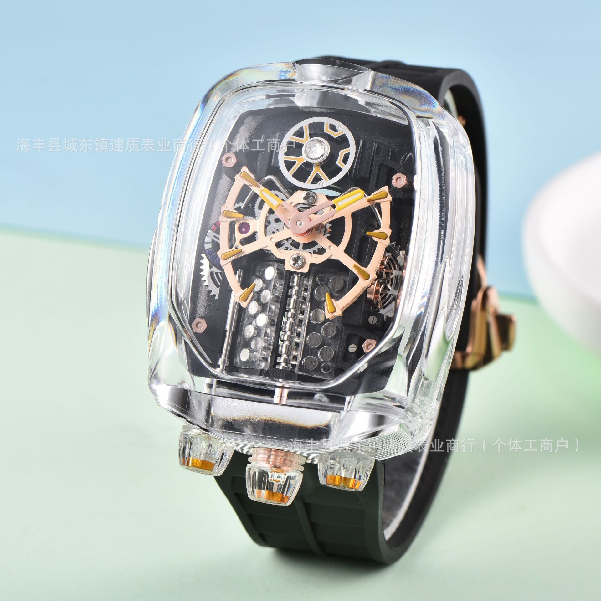 Luxury watch with transparent case and black strap on light blue background