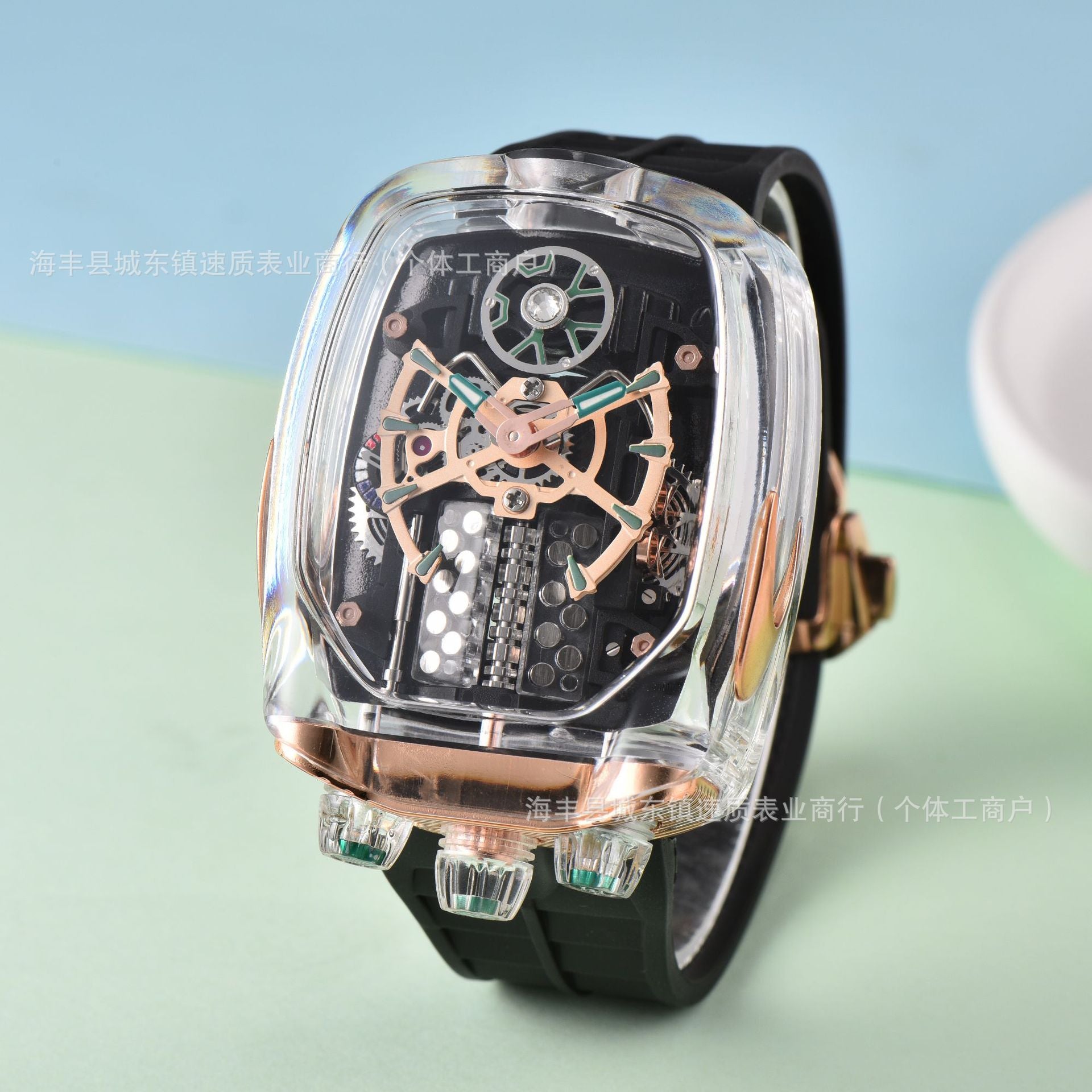 Luxury watch with transparent case and black strap on a light blue and green gradient background