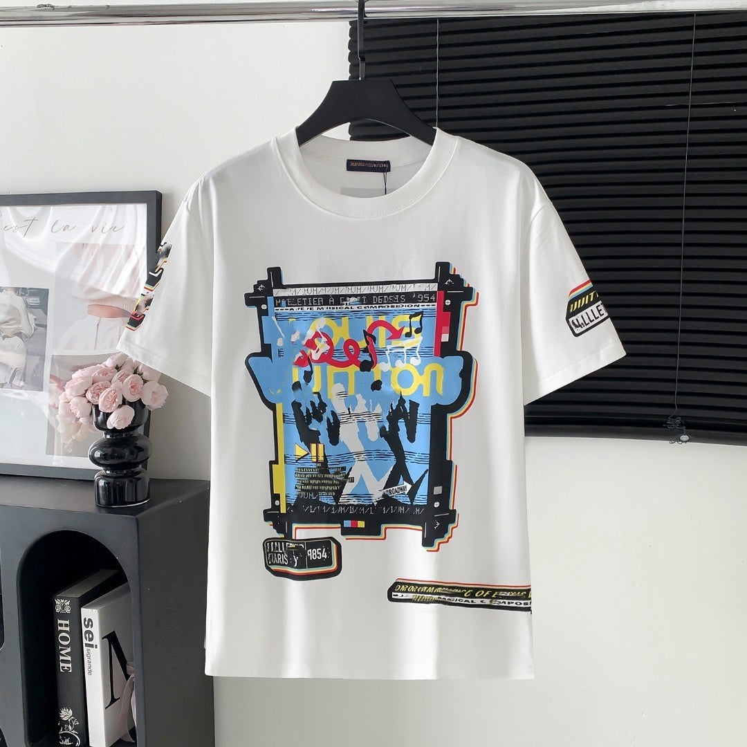 White t-shirt with colorful graphic design on a hanger against a neutral background