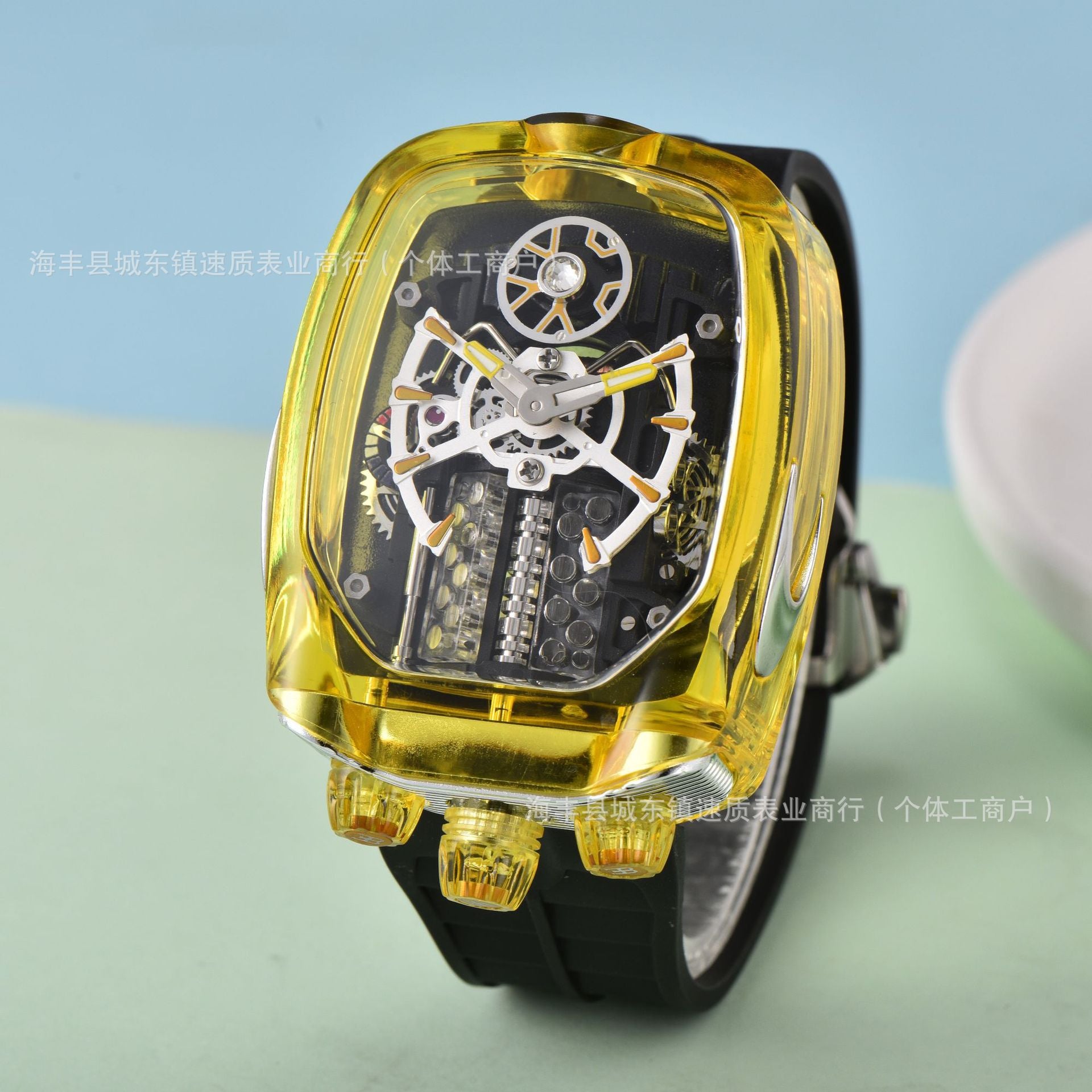Watch with transparent yellow case and black strap on a light blue and green gradient background