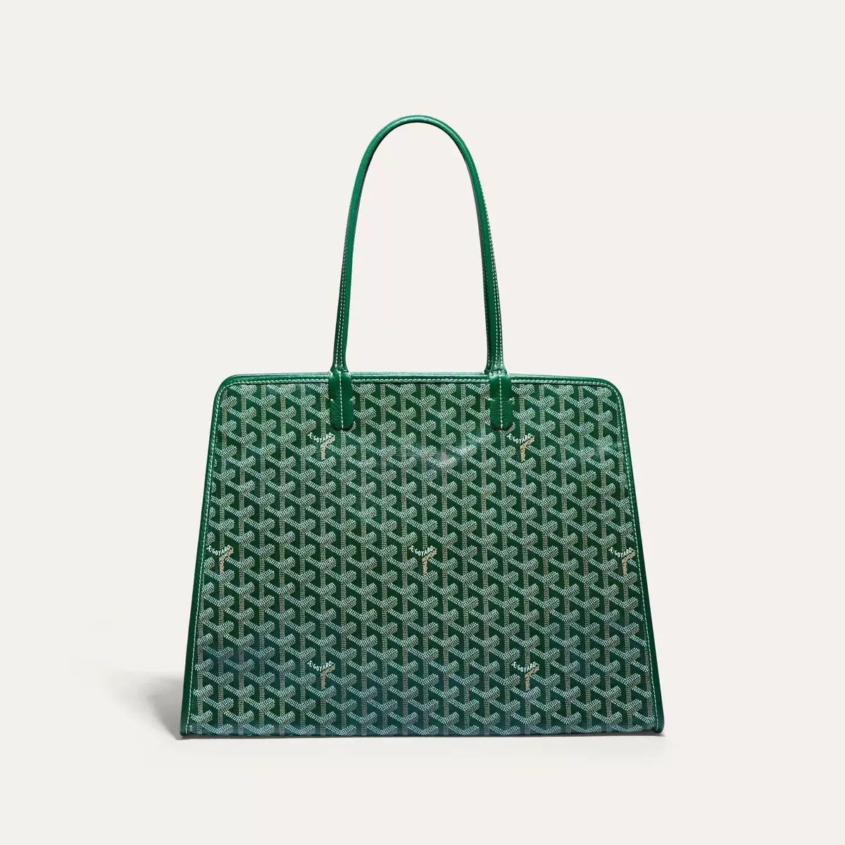 Green handbag with a pattern on a light gray background