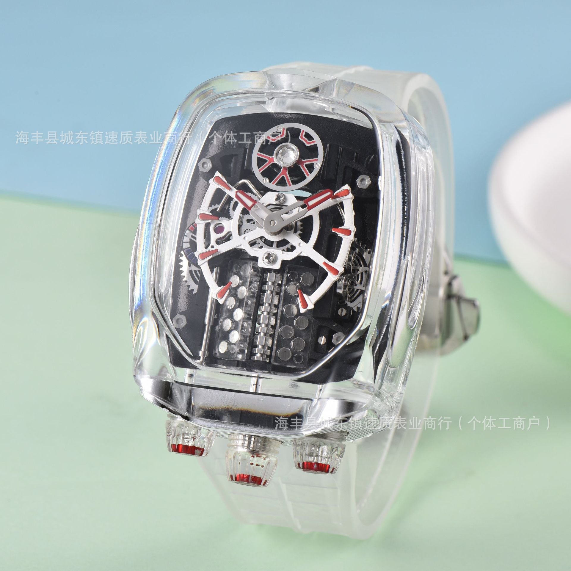 Mechanical watch with transparent case on a light blue and green gradient background