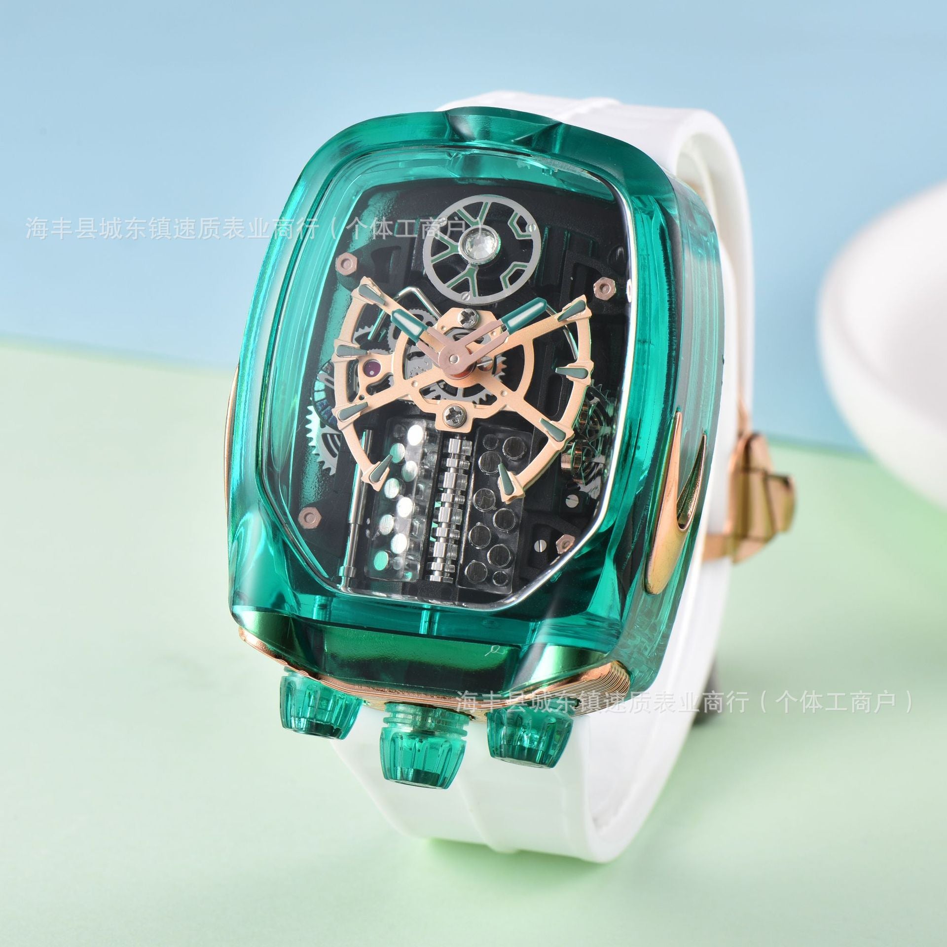 Green transparent wristwatch with white strap on a light blue and green gradient background