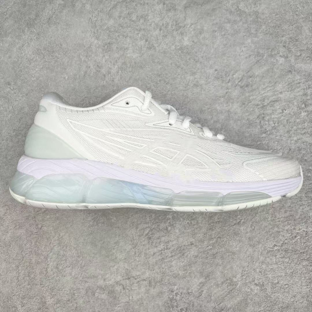 White sneaker with gradient sole on a gray background