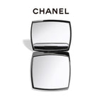 Chanel compact mirror on a white background