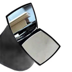 Compact powder with mirror on a white background