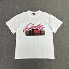 White t-shirt with graphic design on a gray background