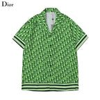 Green patterned shirt with Dior logo on a white background