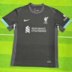 Gray sports jersey with Nike and Liverpool FC logos on a green background
