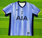Blue and white striped soccer jersey with Nike logo on a green field background