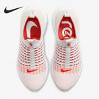 White and red Nike sneakers with visible brand logo on a white background