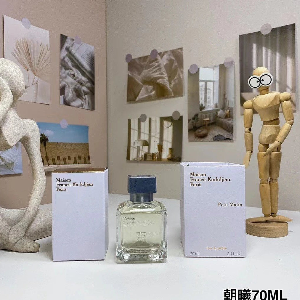 Perfume bottle and packaging with decorative items on a table