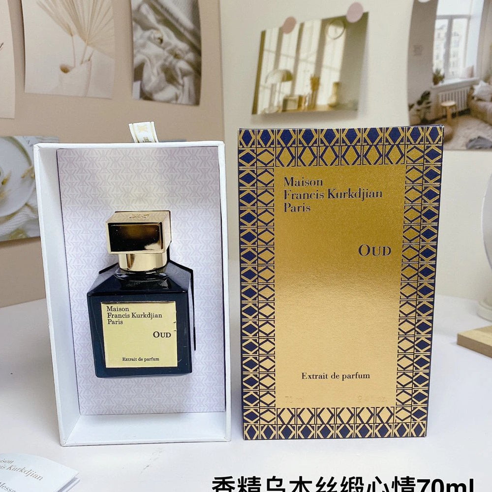 Maison Francis Kurkdjian Oud perfume bottle and packaging on a table.