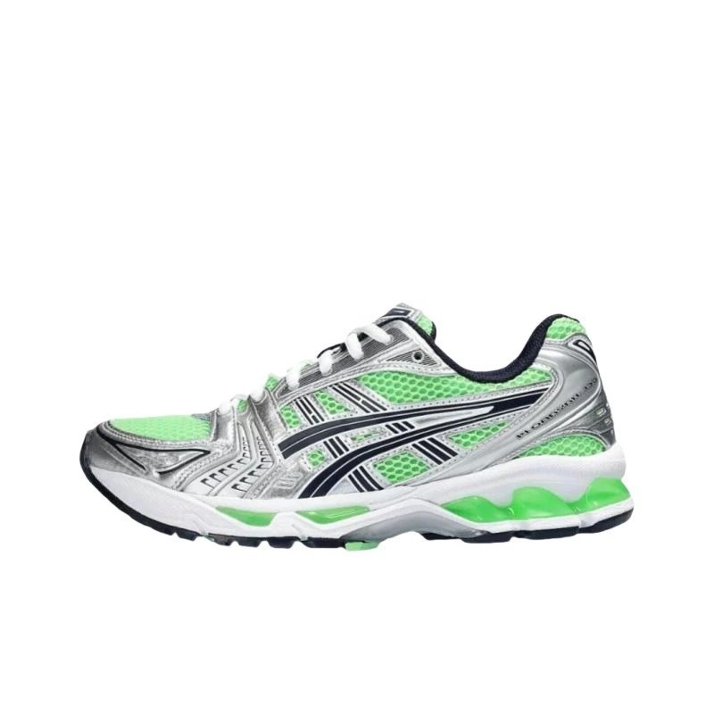 Green and silver running shoe on a white background