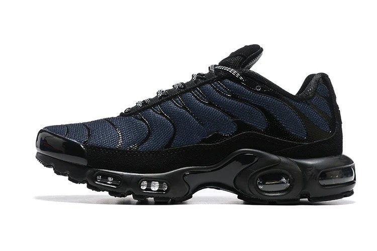 Black and navy sneaker with a prominent air cushion sole on a white background