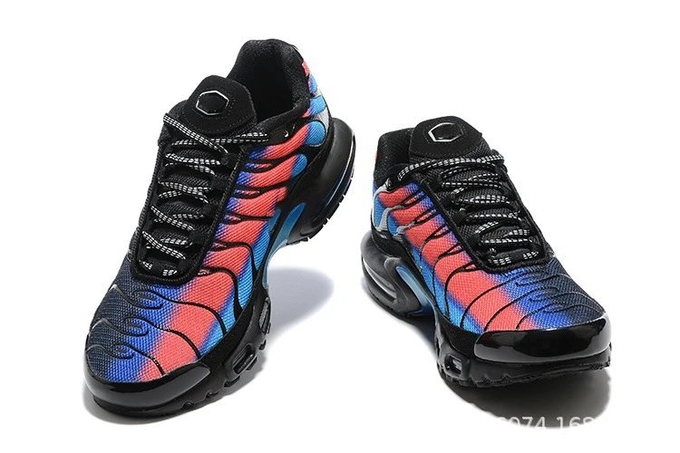 Black, red, and blue sneakers on a white background