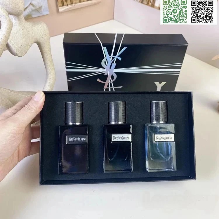 YSL perfume set with three bottles in a black box on a white surface.