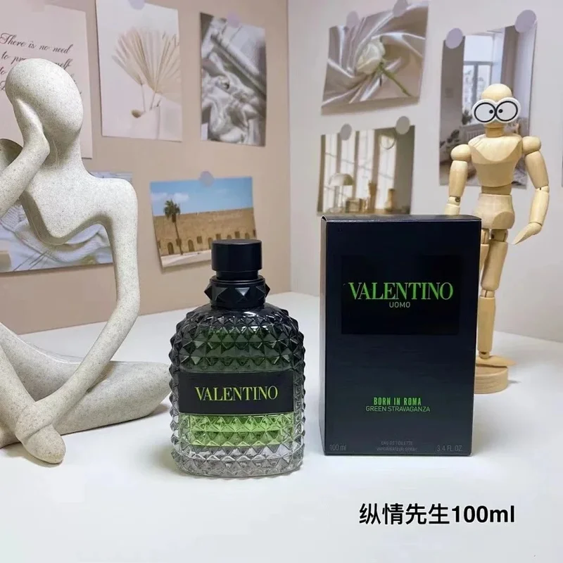 Perfume bottle and packaging on a table with decorative items in the background