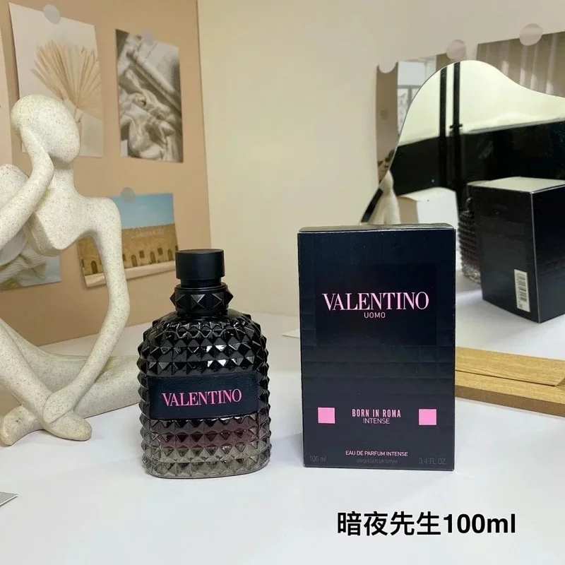 Valentino perfume bottle and packaging on a surface with decorative items in the background