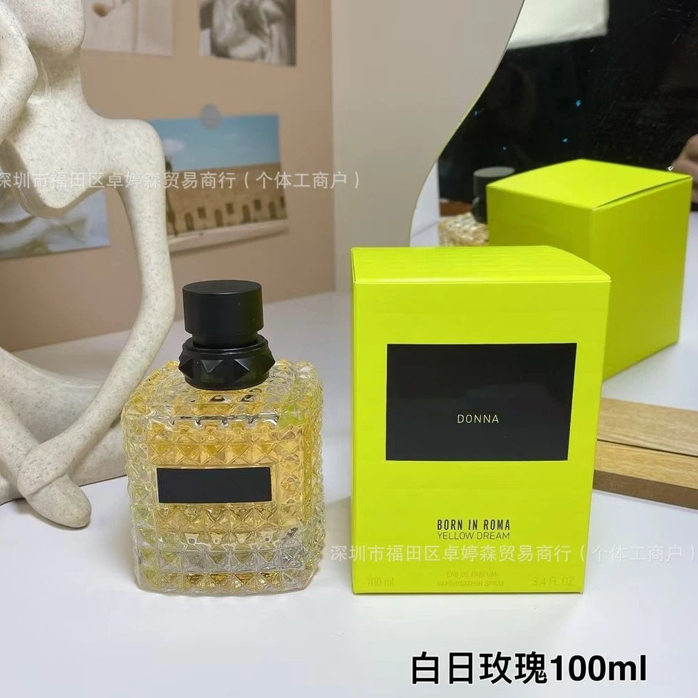 Perfume bottle and packaging with 'Jarcy' branding on a table.