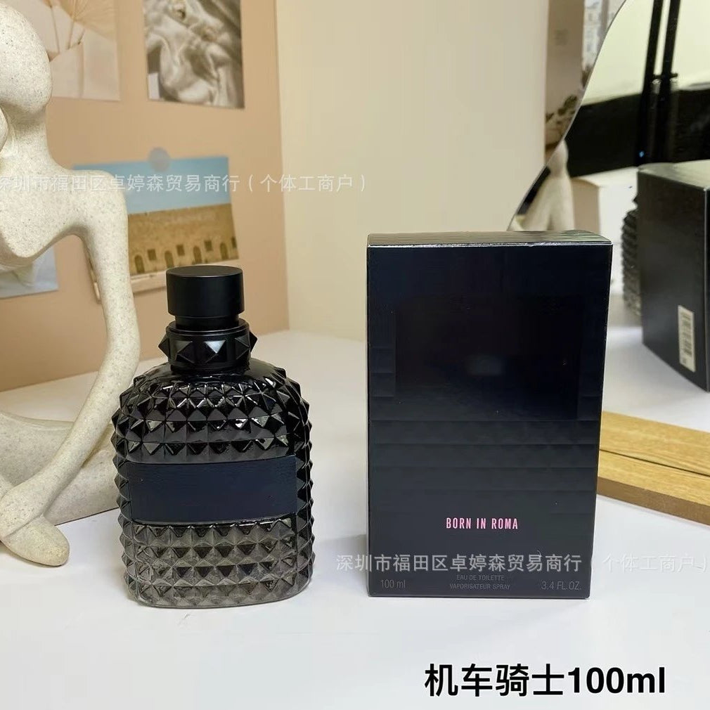 Perfume bottle and packaging on a table with decorative items in the background