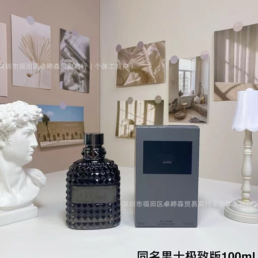 Black diamond-patterned bottle and box on a white surface with decorative elements.
