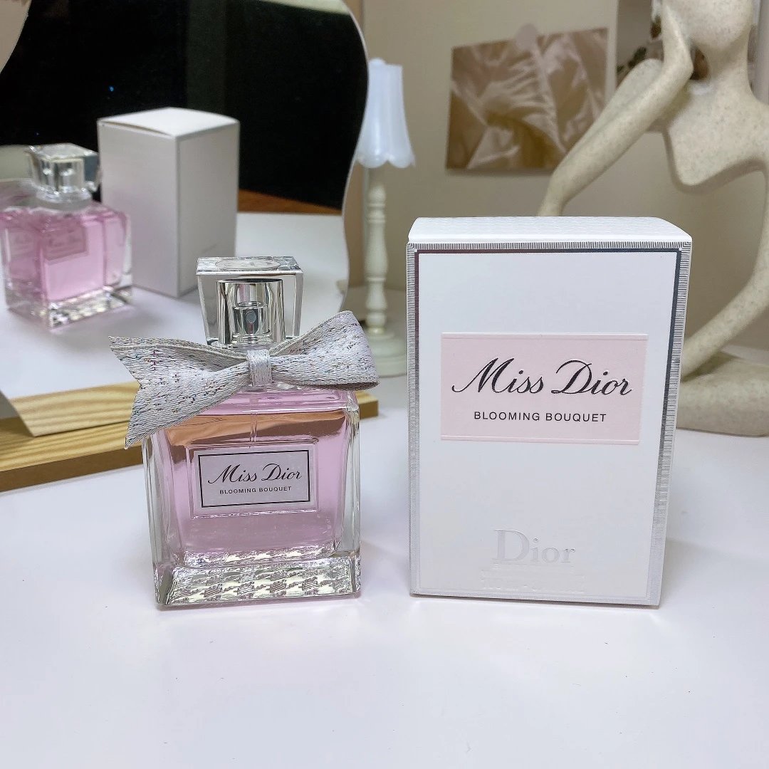 Miss Dior Blooming Bouquet perfume bottle and packaging on a white surface