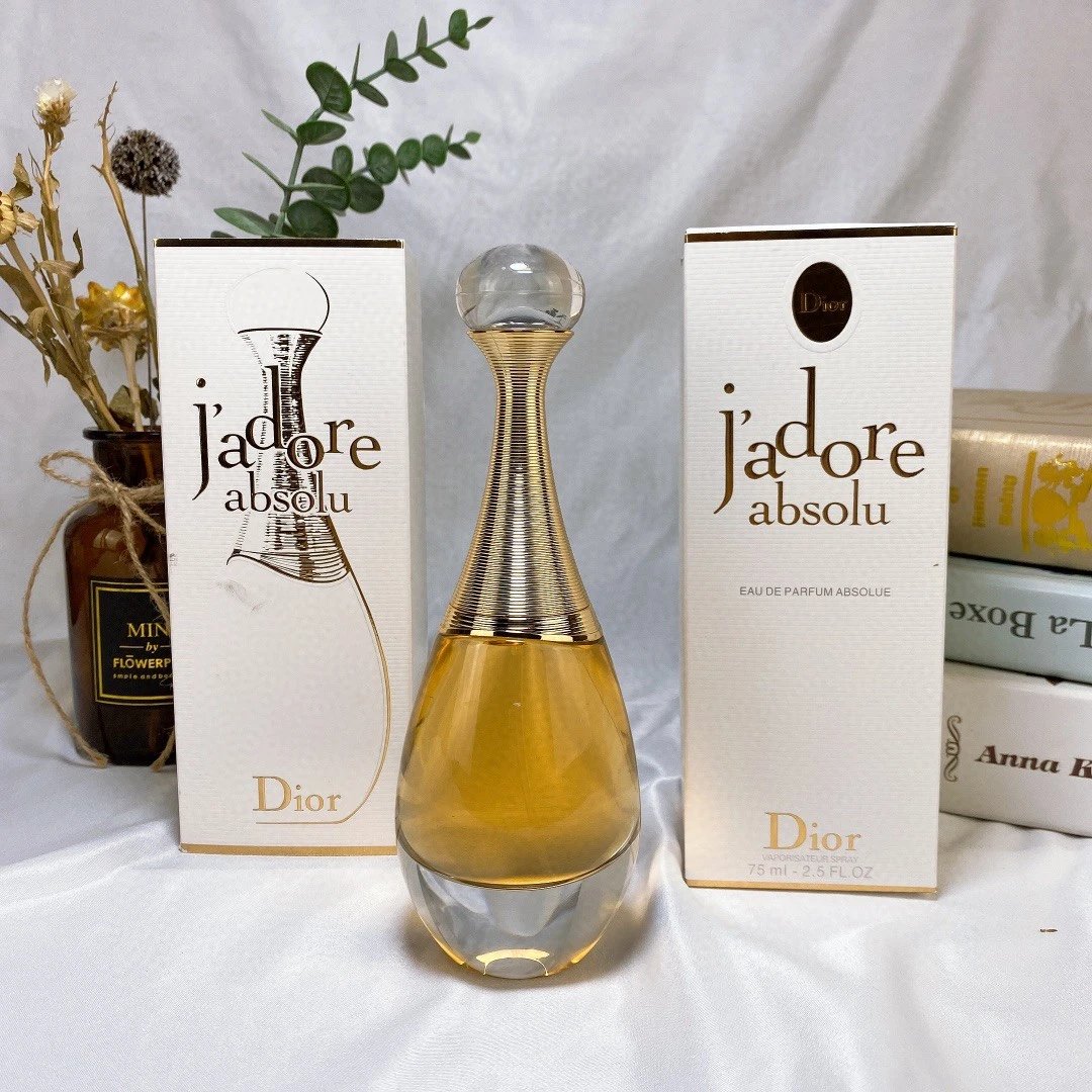 Dior J'adore Absolu perfume bottle with packaging on a white background